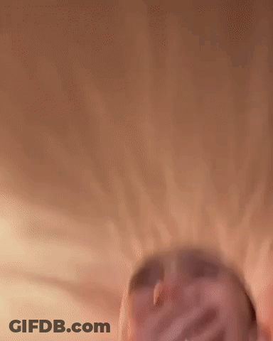 A Close Up Of A Woman Laughing With Her Eyes Closed . GIF