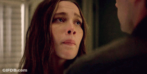 A Close Up Of A Woman Looking At A Man . GIF