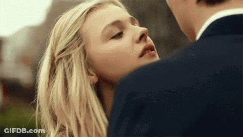 A Close Up Of A Woman Looking At A Man GIF