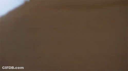 A Close Up Of A Woman Looking At A Man GIF