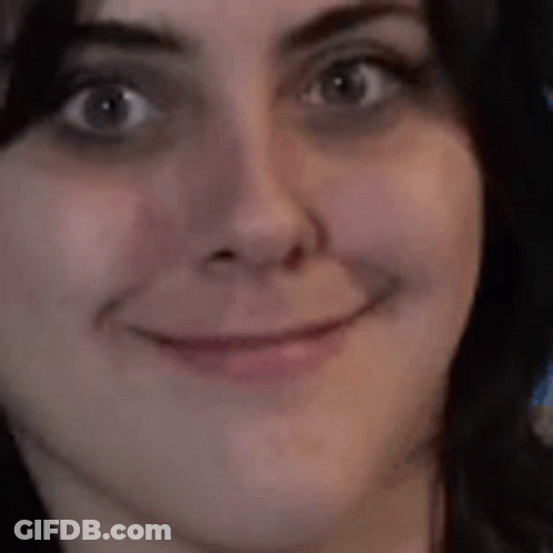 A Close Up Of A Woman Making A Funny Face . GIF