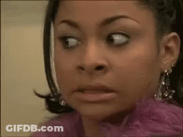 A Close Up Of A Woman Making A Funny Face GIF