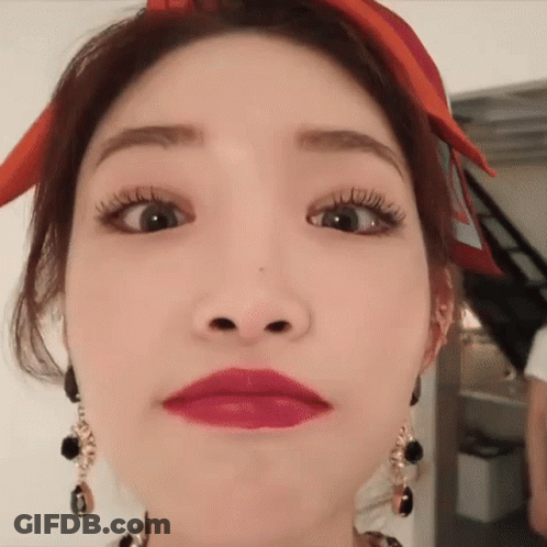 A Close Up Of A Woman Making A Funny Face . GIF