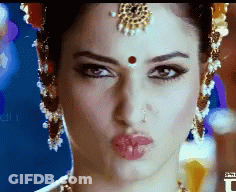 A Close Up Of A Woman Making A Funny Face GIF