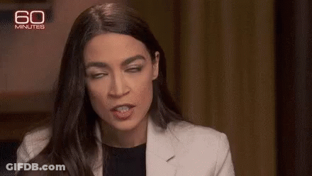 A Close Up Of A Woman Making A Funny Face . GIF