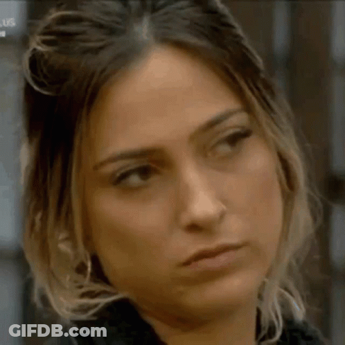 A Close Up Of A Woman Making A Funny Face . GIF