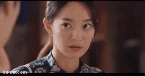 A Close Up Of A Woman Making A Funny Face While Looking At The Camera . GIF