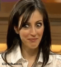 A Close Up Of A Woman Making A Funny Face With Her Eyes Crossed . GIF