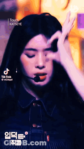 A Close Up Of A Woman Making A Funny Face With Her Hands . GIF