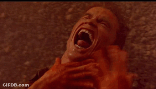 A Close Up Of A Woman Making A Funny Face With Her Mouth Open And Big Red Eyes . GIF