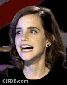 A Close Up Of A Woman Making A Funny Face With Her Mouth Open . GIF