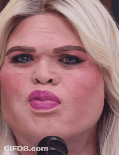 A Close Up Of A Woman Making A Funny Face GIF