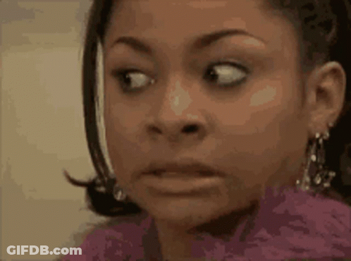 A Close Up Of A Woman Making A Surprised Face . GIF
