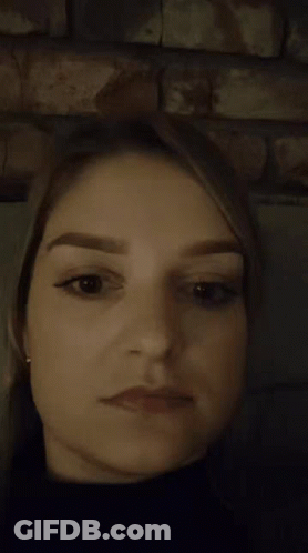 A Close Up Of A Woman Making A Surprised Face GIF