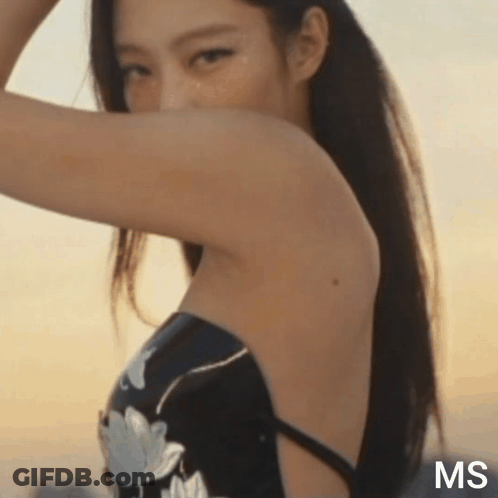 A Close Up Of A Woman 'S Back With The Words Ms On The Bottom GIF