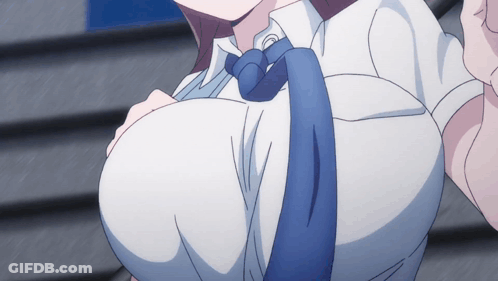 A Close Up Of A Woman 'S Breasts With A Blue Tie Around Her Neck GIF