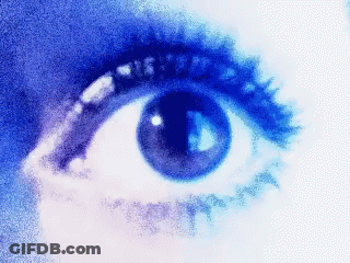 A Close Up Of A Woman 'S Eye With A Blue Background GIF
