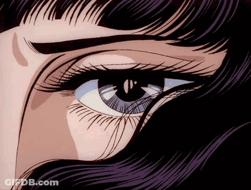 A Close Up Of A Woman 'S Eye With A Purple Fringe GIF