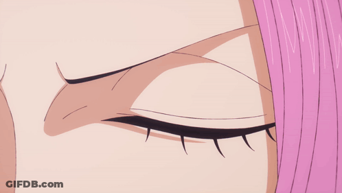 A Close Up Of A Woman 'S Eye With A Purple Pupil GIF