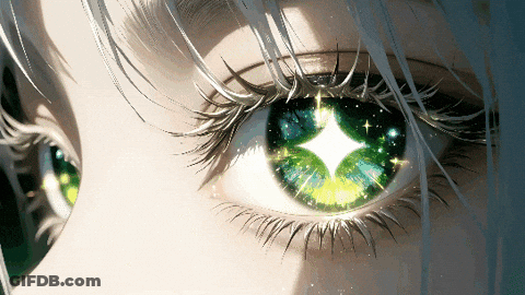 A Close Up Of A Woman 'S Eye With Green Eyes GIF