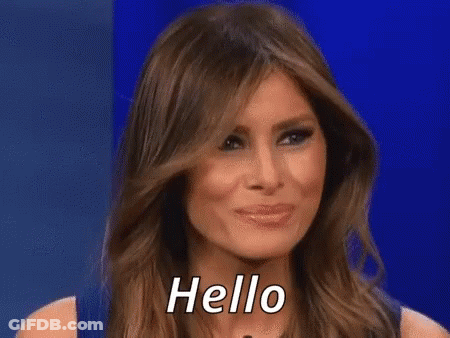 A Close Up Of A Woman 'S Face Against A Blue Background . GIF