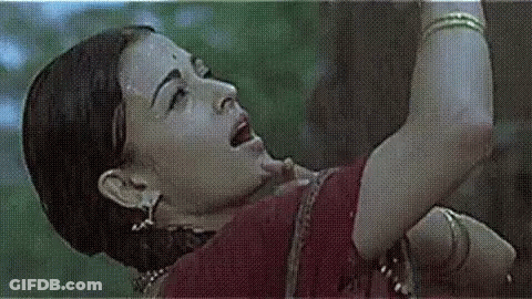 A Close Up Of A Woman 'S Face And Arm With A Grid Pattern . GIF