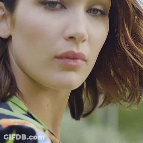 A Close Up Of A Woman 'S Face And Neck GIF