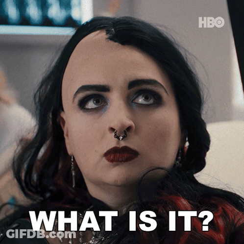 A Close Up Of A Woman 'S Face And The Words What Is It GIF