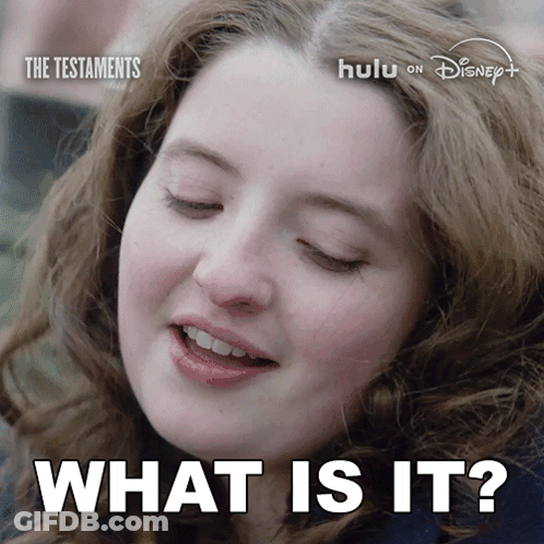 A Close Up Of A Woman 'S Face And The Words What Is It GIF
