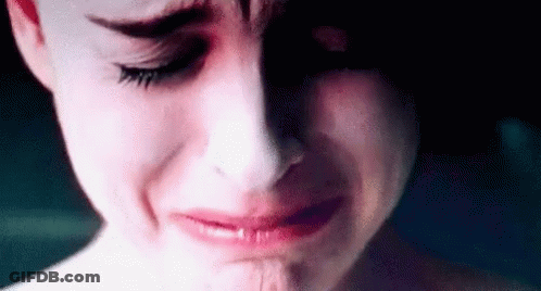 A Close Up Of A Woman 'S Face Crying With Tears Running Down Her Face . GIF