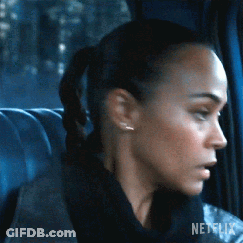 A Close Up Of A Woman 'S Face In A Car With A Ponytail . GIF