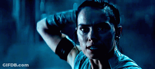 A Close Up Of A Woman 'S Face In A Dark Room GIF
