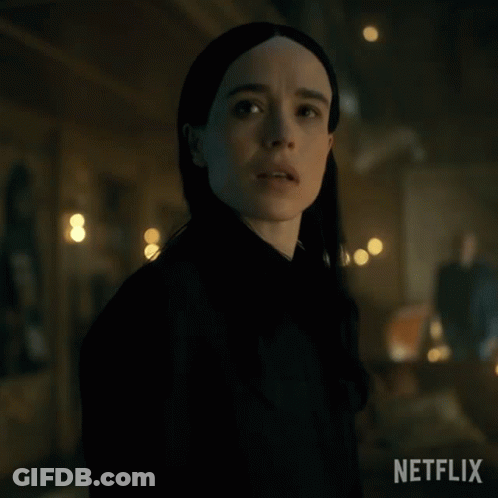 A Close Up Of A Woman 'S Face In A Dark Room With A Netflix Logo In The Corner GIF