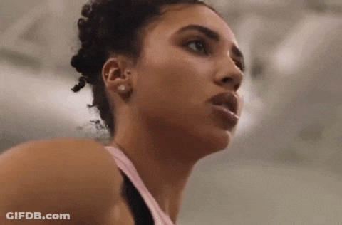 A Close Up Of A Woman 'S Face In A Gym GIF