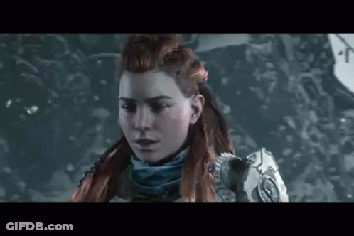 A Close Up Of A Woman 'S Face In A Video Game In The Snow . GIF