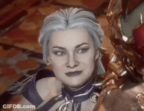 A Close Up Of A Woman 'S Face In A Video Game With Blue Hair And Purple Lipstick . GIF