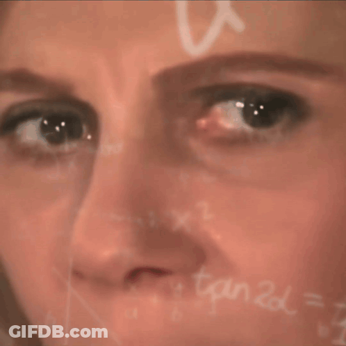 A Close Up Of A Woman 'S Face In Front Of A Chalkboard With X1 Written On It GIF