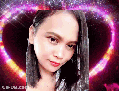 A Close Up Of A Woman 'S Face In Front Of A Heart GIF