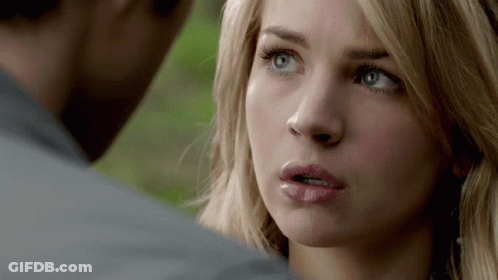 Close Up Woman's Face Looking At Man GIF