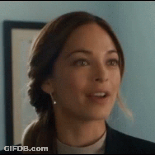 A Close Up Of A Woman 'S Face Making A Funny Face . GIF