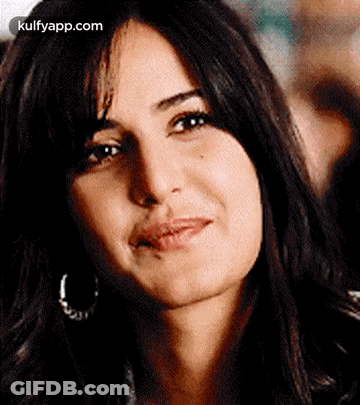 A Close Up Of A Woman 'S Face Making A Funny Face . GIF