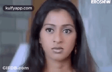 A Close Up Of A Woman 'S Face Making A Funny Face . GIF