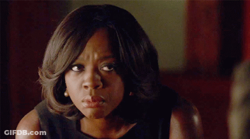 A Close Up Of A Woman 'S Face Making A Funny Face GIF