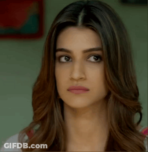 A Close Up Of A Woman 'S Face Making A Funny Face . GIF