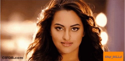 A Close Up Of A Woman 'S Face Next To A Sign That Says ' Shilpa Jalli ' On It GIF