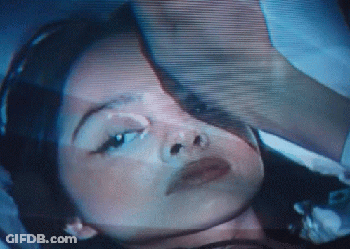 A Close Up Of A Woman 'S Face On A Screen GIF