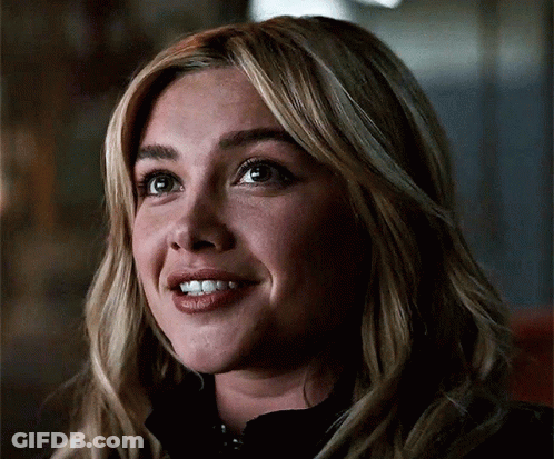 A Close Up Of A Woman 'S Face Smiling GIF
