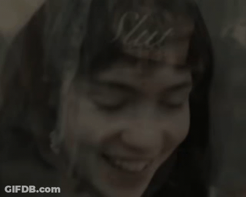 A Close Up Of A Woman 'S Face Smiling GIF