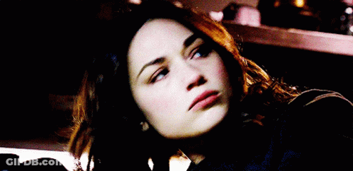 A Close Up Of A Woman 'S Face Smiling GIF