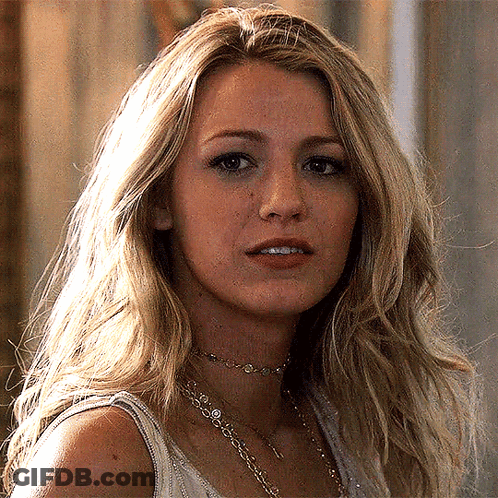 A Close Up Of A Woman 'S Face Wearing A Choker And A Tank Top GIF